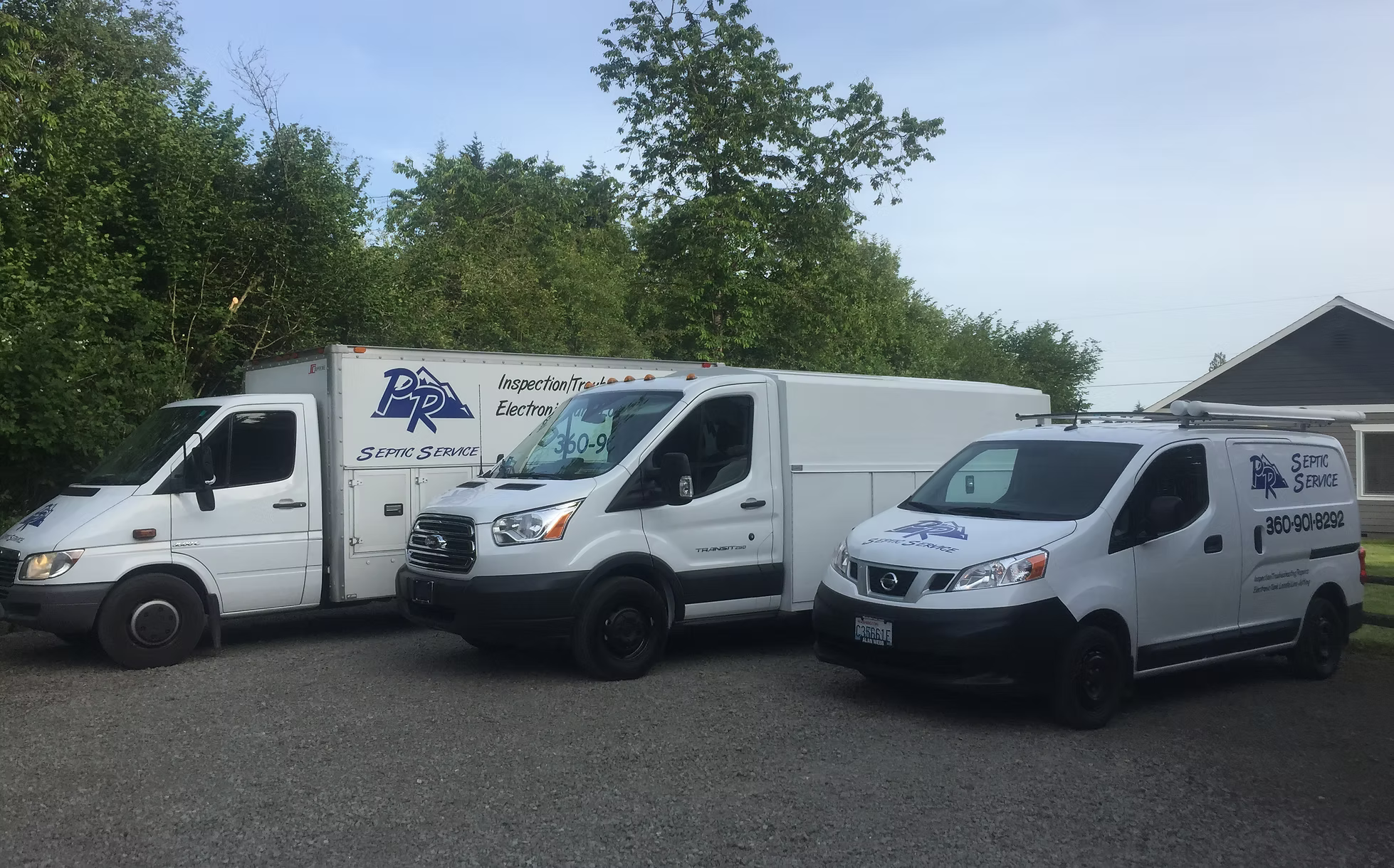 PR Septic Service fleet of three branded vehicles